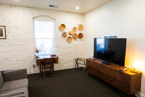 a living room with a large flat screen tv at Lander Millhouse in Lander