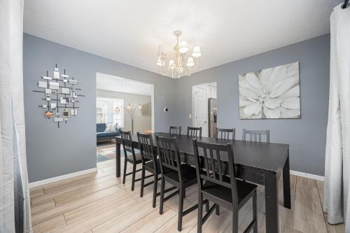a dining room with a black table and chairs at Spacious Columbus Retreat Activities and Games Galore in Columbus