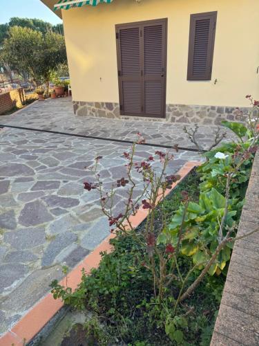 a stone walkway in front of a house at Casa Lucia in Strada