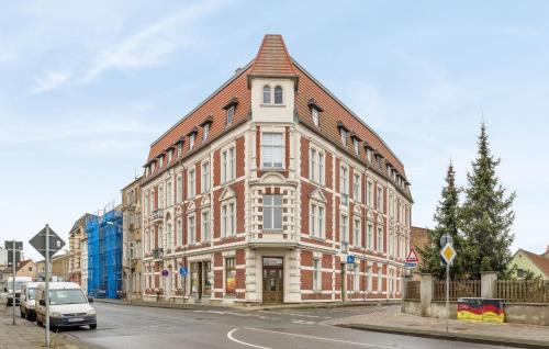 a large brick building on the corner of a street at 1 Bedroom Stunning Apartment In Anklam in Anklam