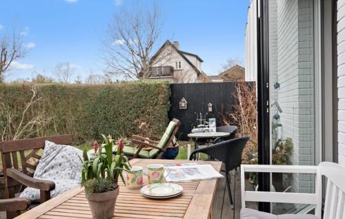 a table and chairs on a patio with a table at 2 Bedroom Gorgeous Home In Espergærde in Espergærde