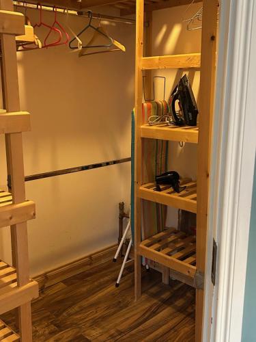 a closet with wooden shelves in a room at Castletown Carlow in Carlow