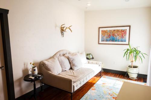 a living room with a couch and a table at Lander Millhouse in Lander