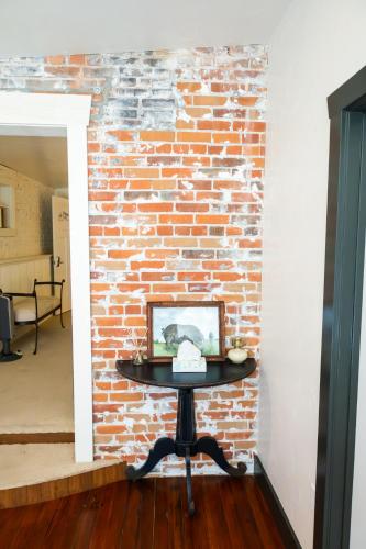 a table in front of a brick wall at Lander Millhouse in Lander