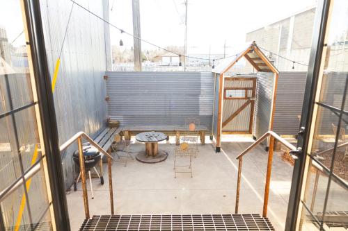 a balcony with a table and chairs in a building at Lander Millhouse in Lander