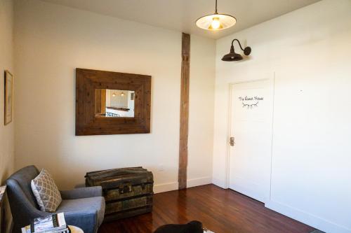 a living room with a couch and a mirror at Lander Millhouse in Lander