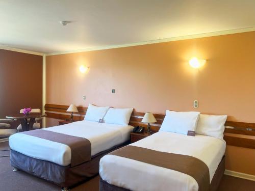 a hotel room with two beds in a room at DM Hoteles Arequipa in Arequipa