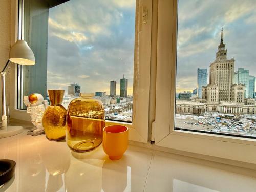 a window with a view of a city skyline at Sawa 7 WiFi8Gbs 85'TV 4K Netflix in Warsaw