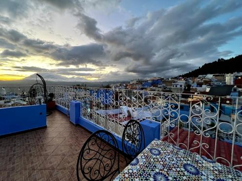 a balcony with a view of a city at RIAD CHENGLI 蓝城里 in Chefchaouene