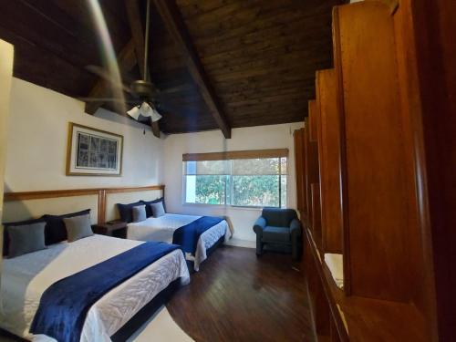 Postel nebo postele na pokoji v ubytování Casa De La O Yautepec