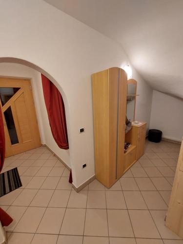 a room with a cabinet in the corner of a room at Dolomiten Home in Villnoss