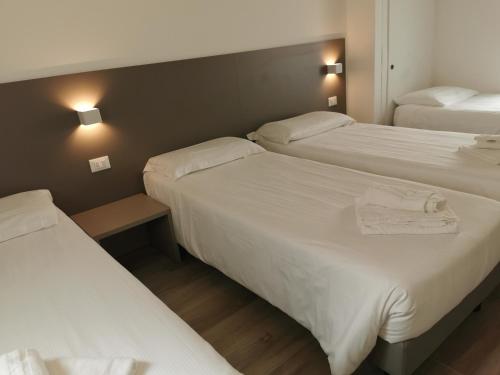 Postel nebo postele na pokoji v ubytování Hotel Sonia