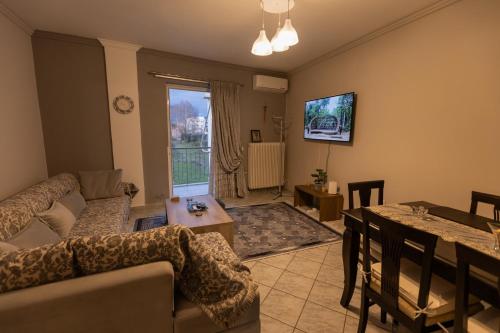 a living room with a couch and a table at Vicky 's Luxury House in Nafpaktos