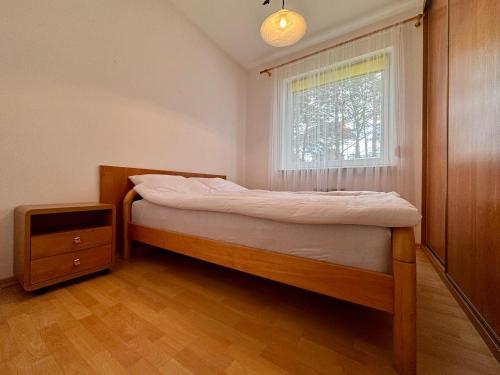 Ένα ή περισσότερα κρεβάτια σε δωμάτιο στο Apartament Malwa Jurata