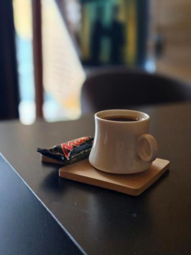 a cup of coffee sitting on top of a table at Chopan Resort Aparan in Aparan