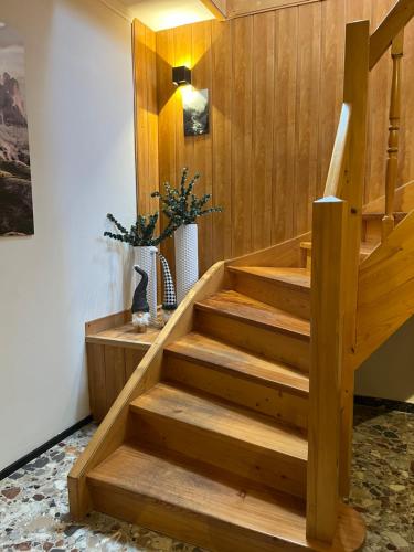 a staircase in a room with wooden walls at Bergblick Appartements in Bad Gastein