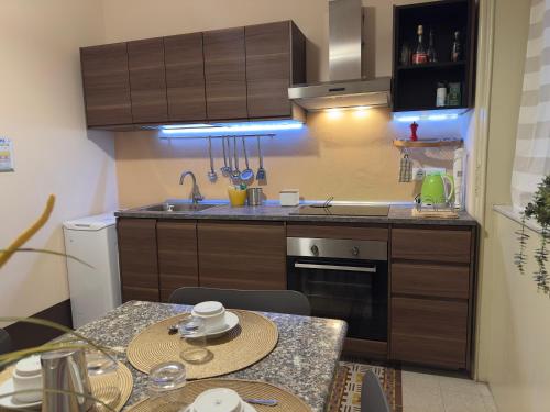 a small kitchen with a table and a counter top at L'Angolo di Palermo in Palermo