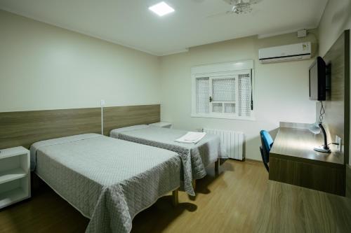 Katil atau katil-katil dalam bilik di Hotel Prata Villaggio
