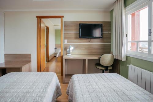 Katil atau katil-katil dalam bilik di Hotel Prata Villaggio