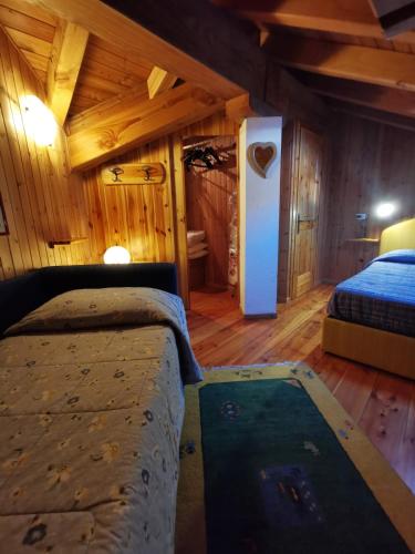Postel nebo postele na pokoji v ubytování Cogne - Gran Paradiso Chalet La Grivola