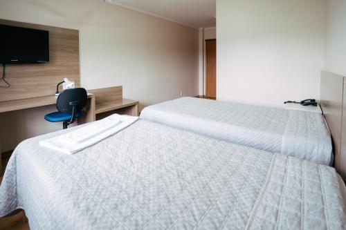 Katil atau katil-katil dalam bilik di Hotel Prata Villaggio