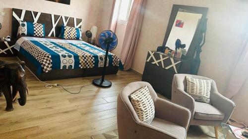 Postel nebo postele na pokoji v ubytování Chez MHD