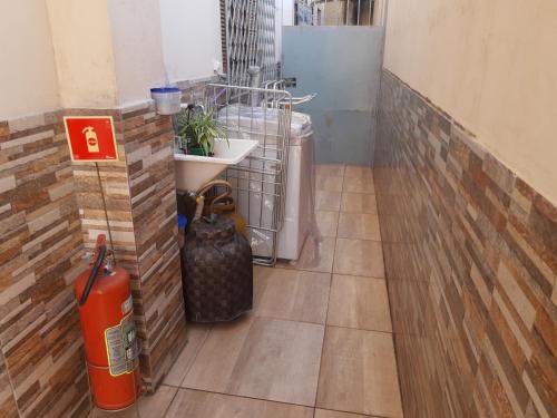 a room with a heater and a fire hydrant at Casa Da Vovó Helena in Vila Velha