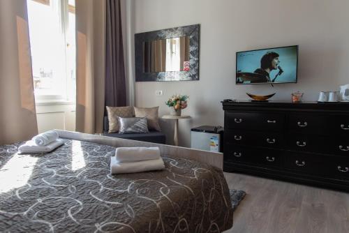 a bedroom with a bed and a dresser at Capital Luxury Rooms Split in Split