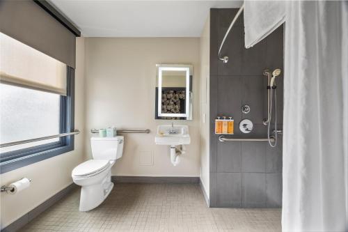 a bathroom with a toilet and a sink and a shower at Hotel EPIK in San Francisco