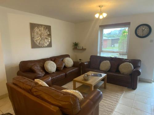 Ein Sitzbereich in der Unterkunft SNOWDONIA COTTAGE Glan Gwna Holiday Park