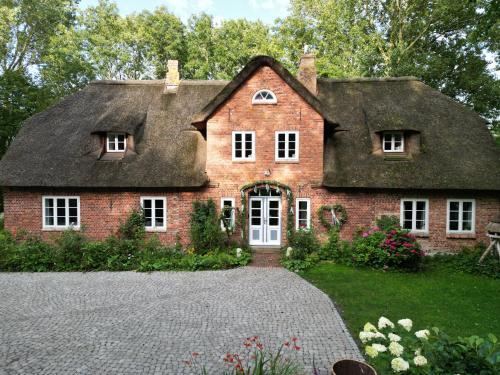 Zahrada ubytování Reetdachhaus Warft Simmerdeis - Maisonettewohnung