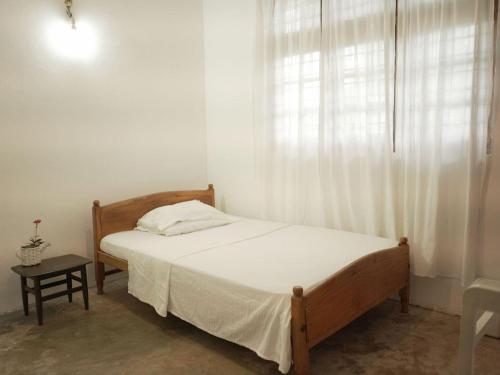 Postel nebo postele na pokoji v ubytování Amma's Homestay