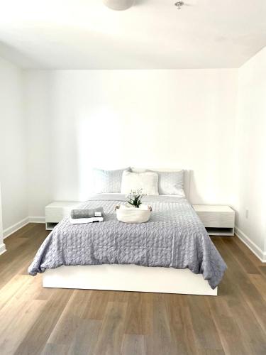 a white bedroom with a large bed and white walls at Private bedroom in Miami - Coral Gables 601 in Miami