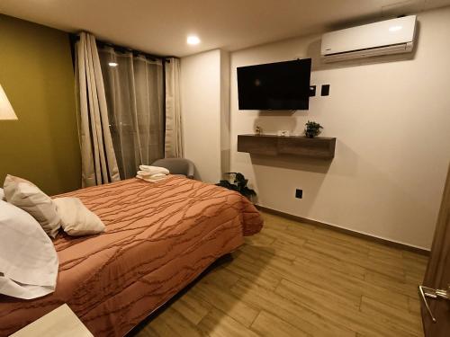 Postel nebo postele na pokoji v ubytování Basento Deluxe Apartment with parking pool gym padel