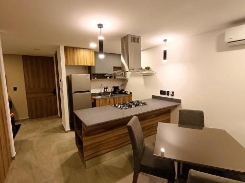 Kuchyň nebo kuchyňský kout v ubytování Basento Deluxe Apartment with parking pool gym padel
