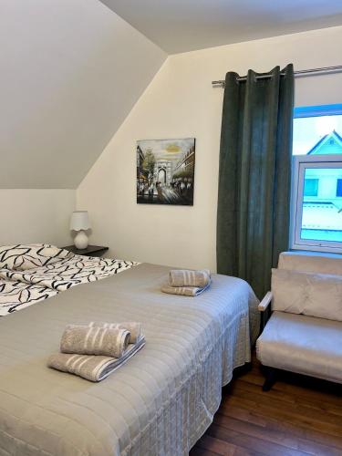 a bedroom with a bed and a window at Top apartment with a view in Tromsø