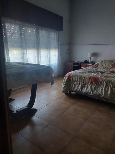 Ένα ή περισσότερα κρεβάτια σε δωμάτιο στο Hogar Calido en Wilde