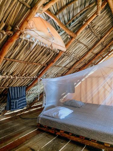 Postel nebo postele na pokoji v ubytování Nimbu Beachhouse