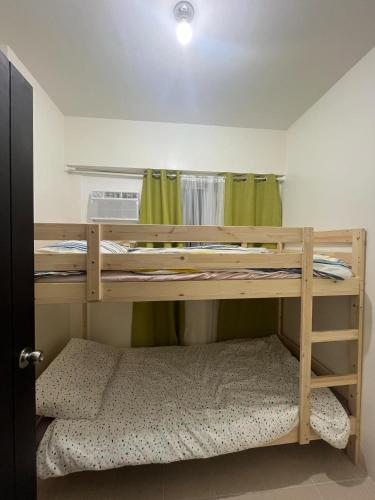 Ένα ή περισσότερα κρεβάτια σε δωμάτιο στο 3BR at The Rochester