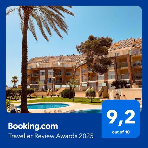 a picture of a hotel with a palm tree at Denia_Azul Marino_playa in Denia