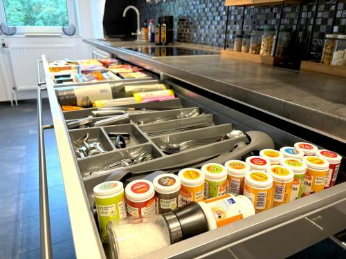 a counter in a store filled with lots of food at Ruhe Oase Steinhöfel - Balkon, Naturblick, Design-Maisonette-Apartment - nahe Fürstenwalde-Spree in Steinhöfel
