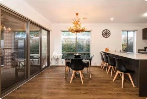 a kitchen and dining room with a dining table and chairs at hayes getaway in Rosebud