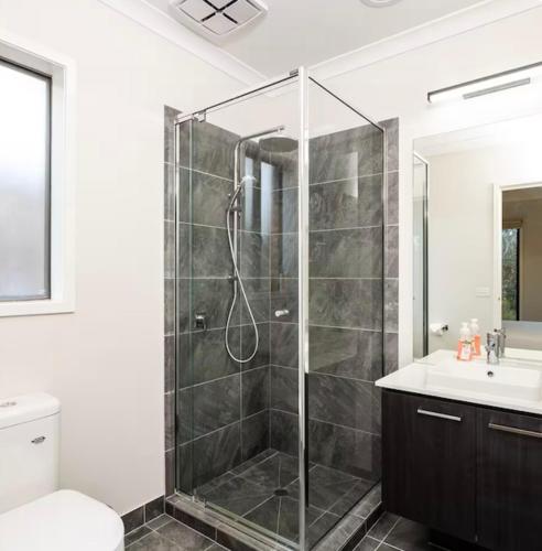 a bathroom with a shower and a sink at hayes getaway in Rosebud