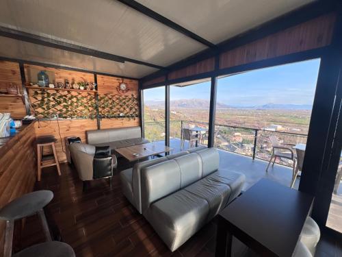 a living room with a couch and a table at Hotel I Pari in Shkodër