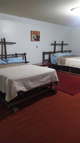 Postel nebo postele na pokoji v ubytování Hotel Rincón Paraíso
