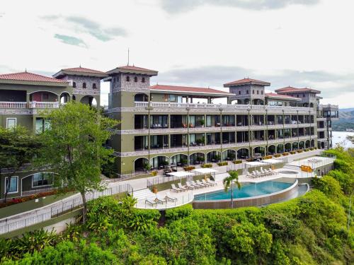 a hotel with a swimming pool and a resort at 360 Splendor 101B Ocean View Studio With Breakfast in Playa Flamingo