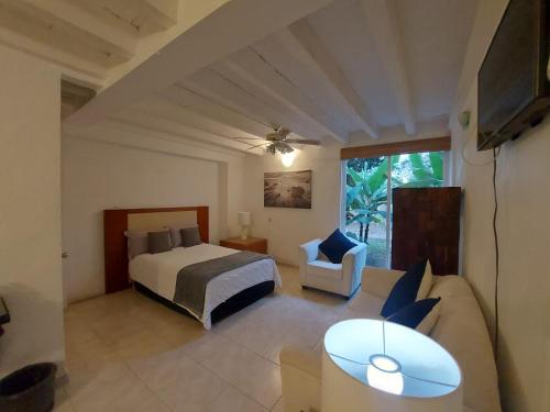 Postel nebo postele na pokoji v ubytování Casa De La O Yautepec