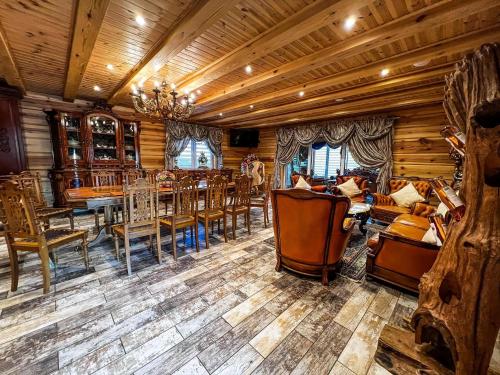 a dining room with wooden floors and tables and chairs at Amazing 14 Berth Villa With Private Pool At Pentney Lakes In Norfolk Ref 34079A in Kings Lynn