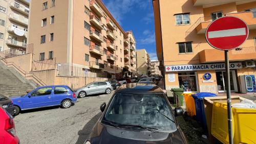 a group of cars parked on a street next to buildings at RUSS0 ROOMS Catanzaro in Catanzaro