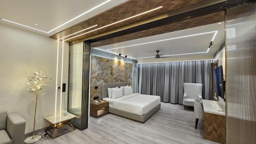 Ένα ή περισσότερα κρεβάτια σε δωμάτιο στο Narang Hotel